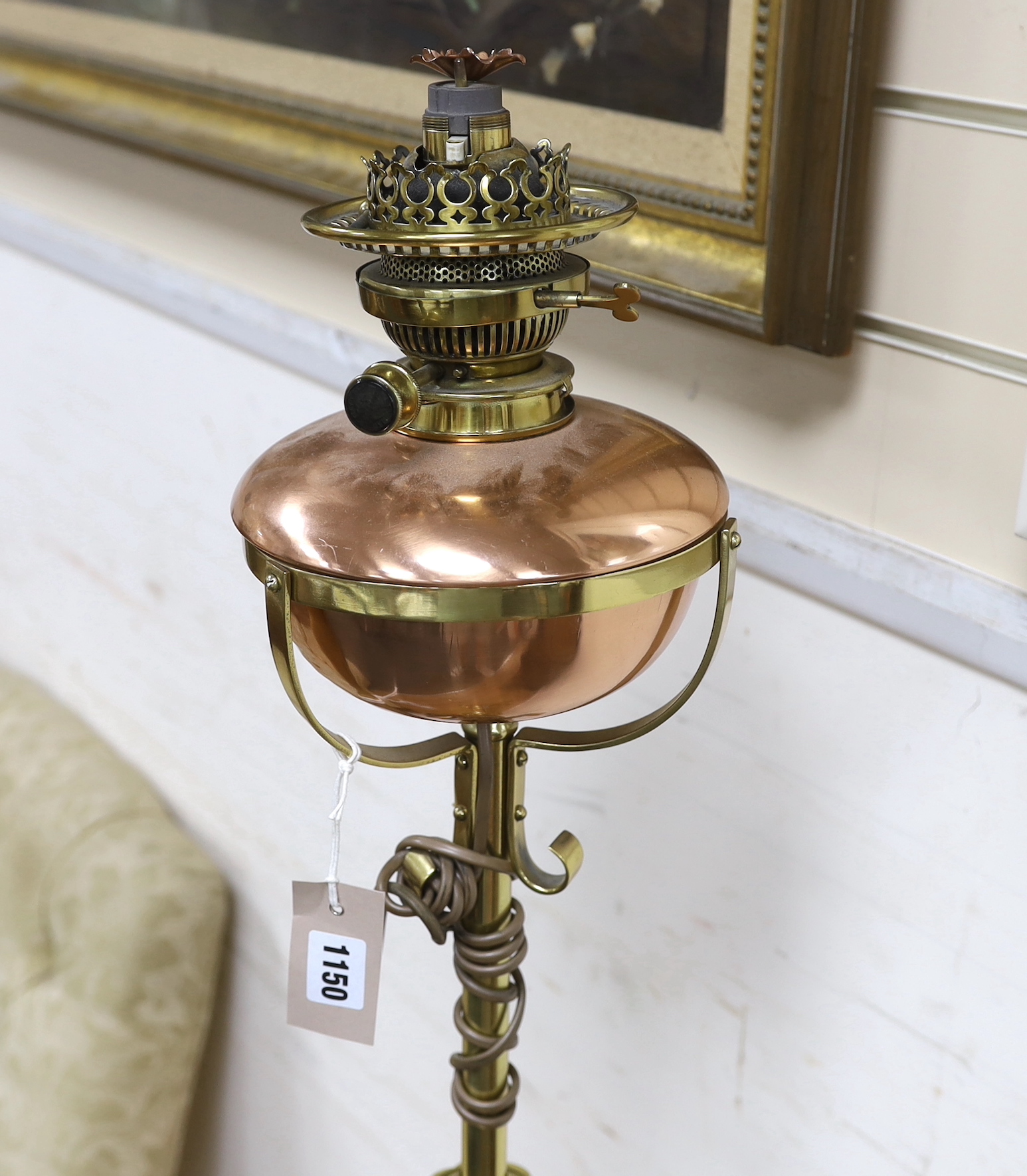 A late Victorian copper and brass telescopic oil standard lamp converted to electricity, height 156cm